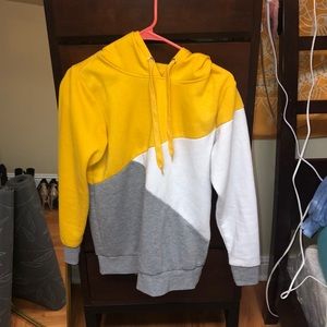 yellow/grey/white hoodie.